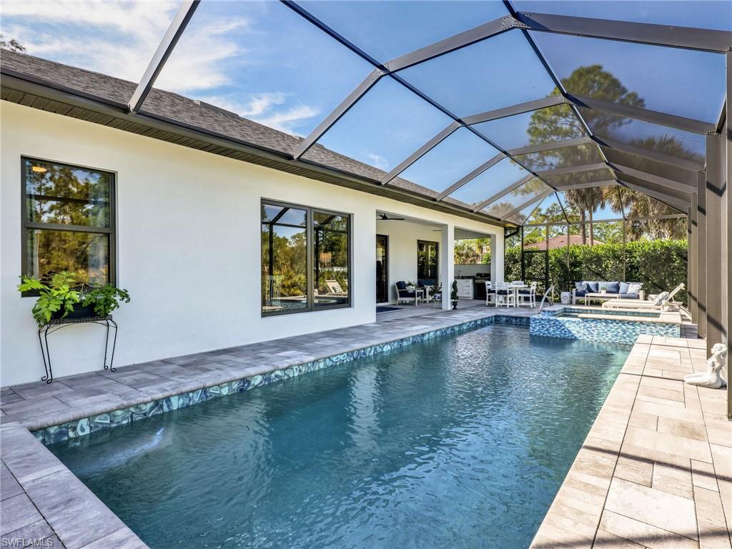 2007 22nd Avenue Northeast Naples, FL 34120 - Photo 36 of 47 Pool & Spa With Covered Lanai, & Privacy Hedges