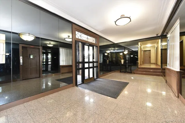 a lobby with entryway and a hallway