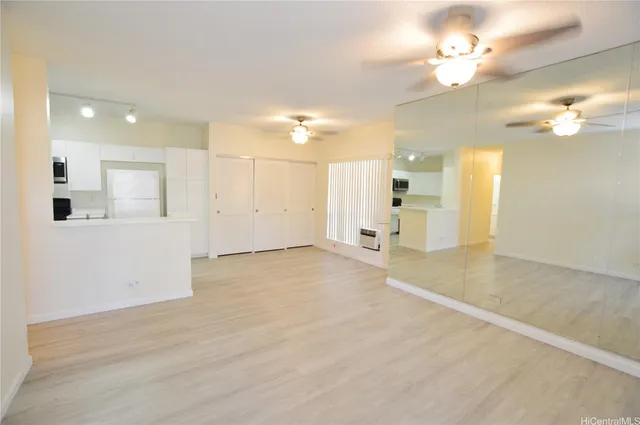 a view of a livingroom with a kitchen
