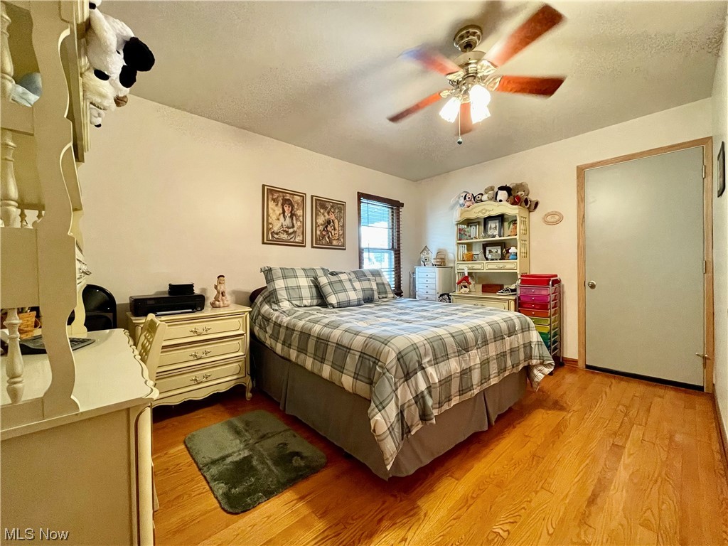 66119 Highway 124 Reedsville, OH 45772 - Photo 12 of 29 Hardwood floored bedroom featuring ceiling fan