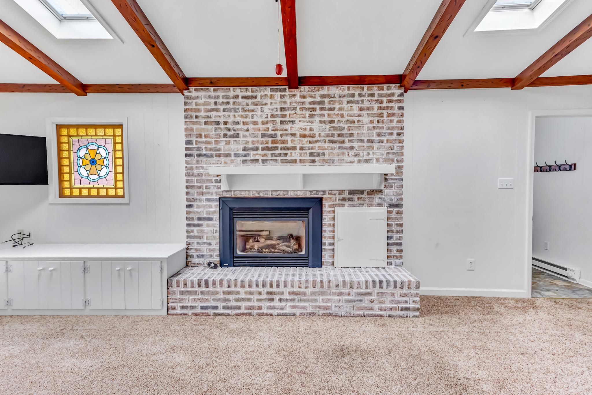 11163 Stewart Neck Road Princess Anne, MD 21853 - Photo 20 of 80 Gorgeous white washed brick gas fireplace.
