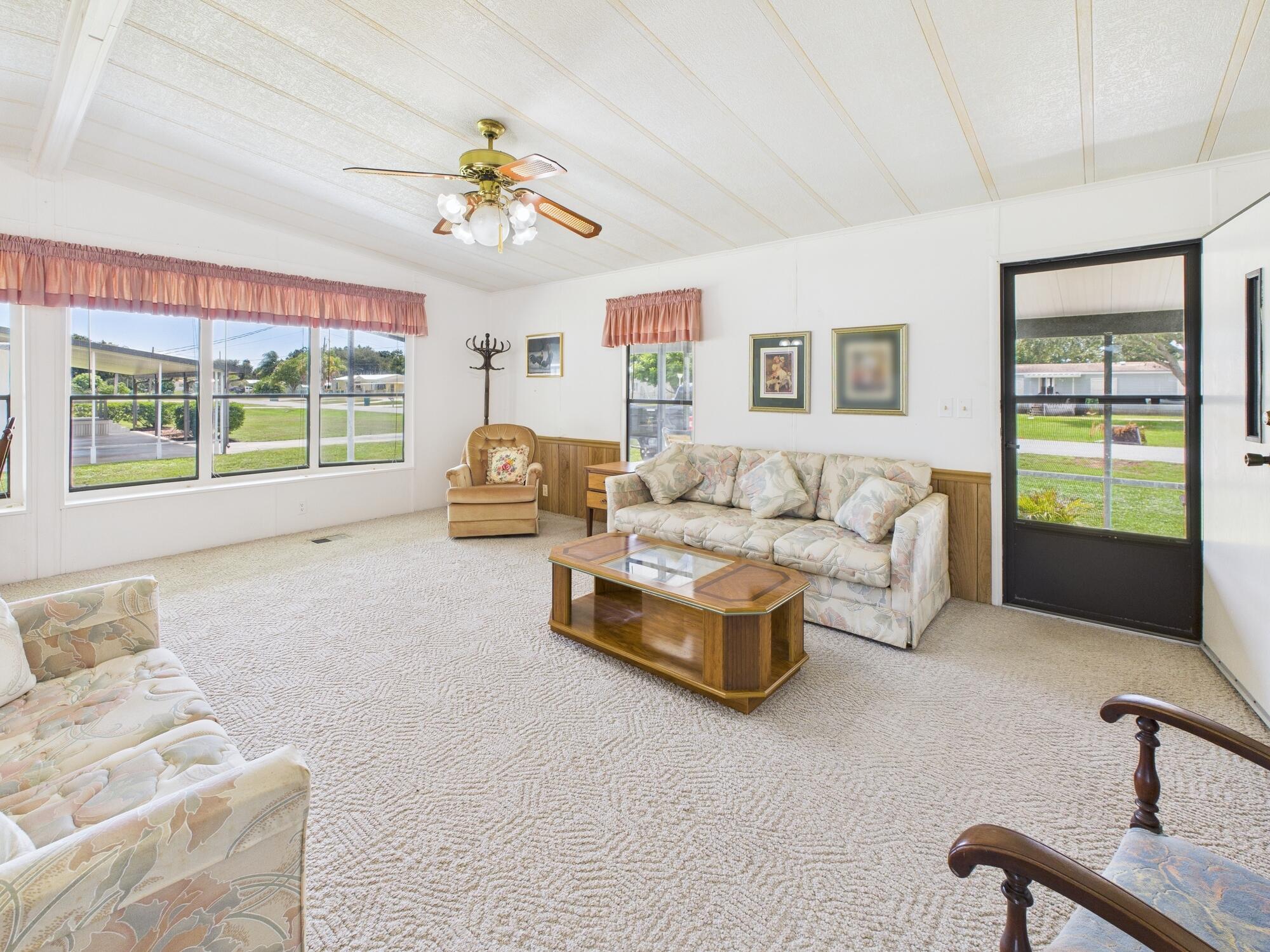 2001 Southeast 27th Street Okeechobee, FL 34974 - Photo 11 of 57 a living room with furniture and a large window