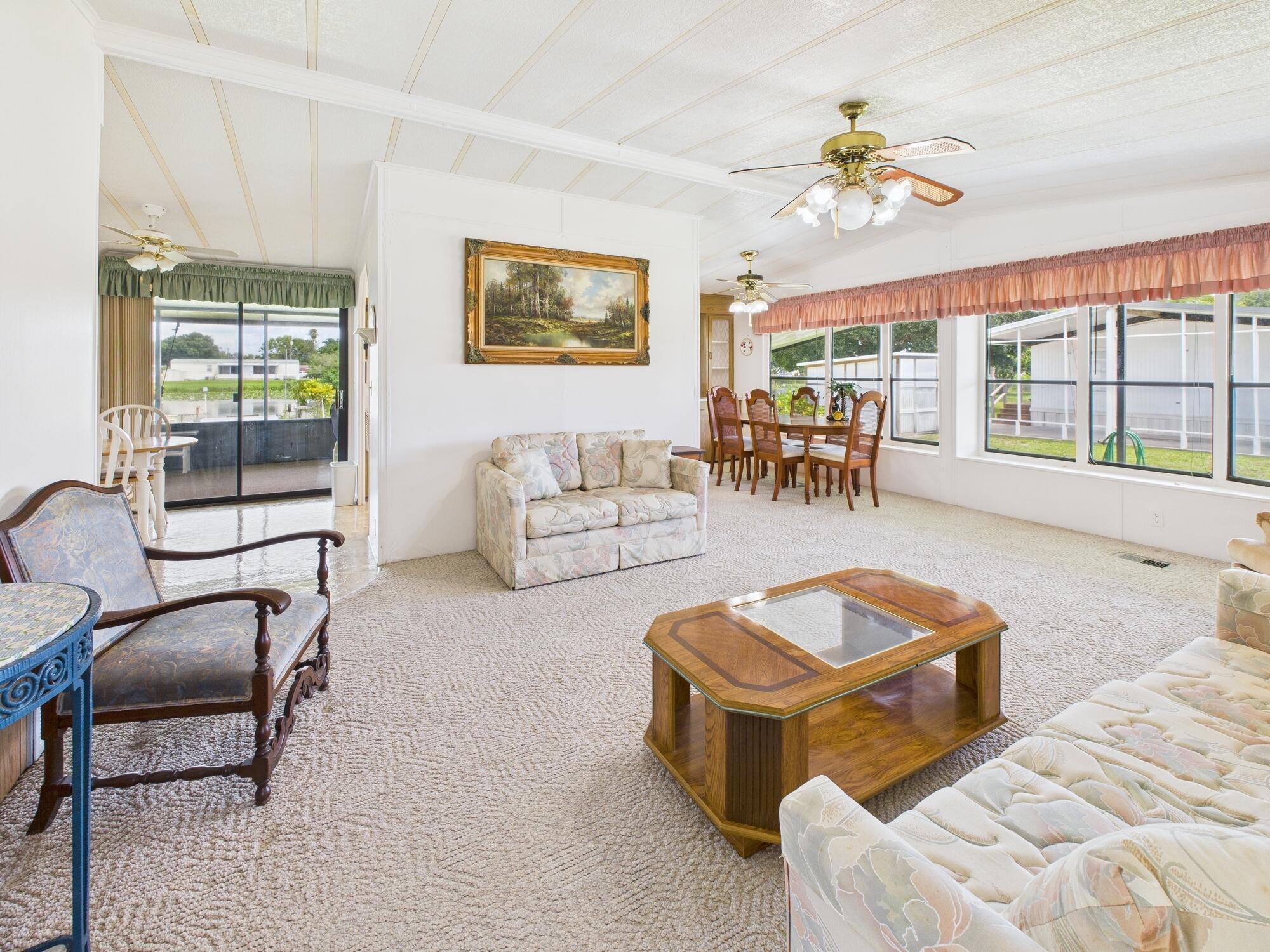 2001 Southeast 27th Street Okeechobee, FL 34974 - Photo 12 of 57 a living room with furniture and a table