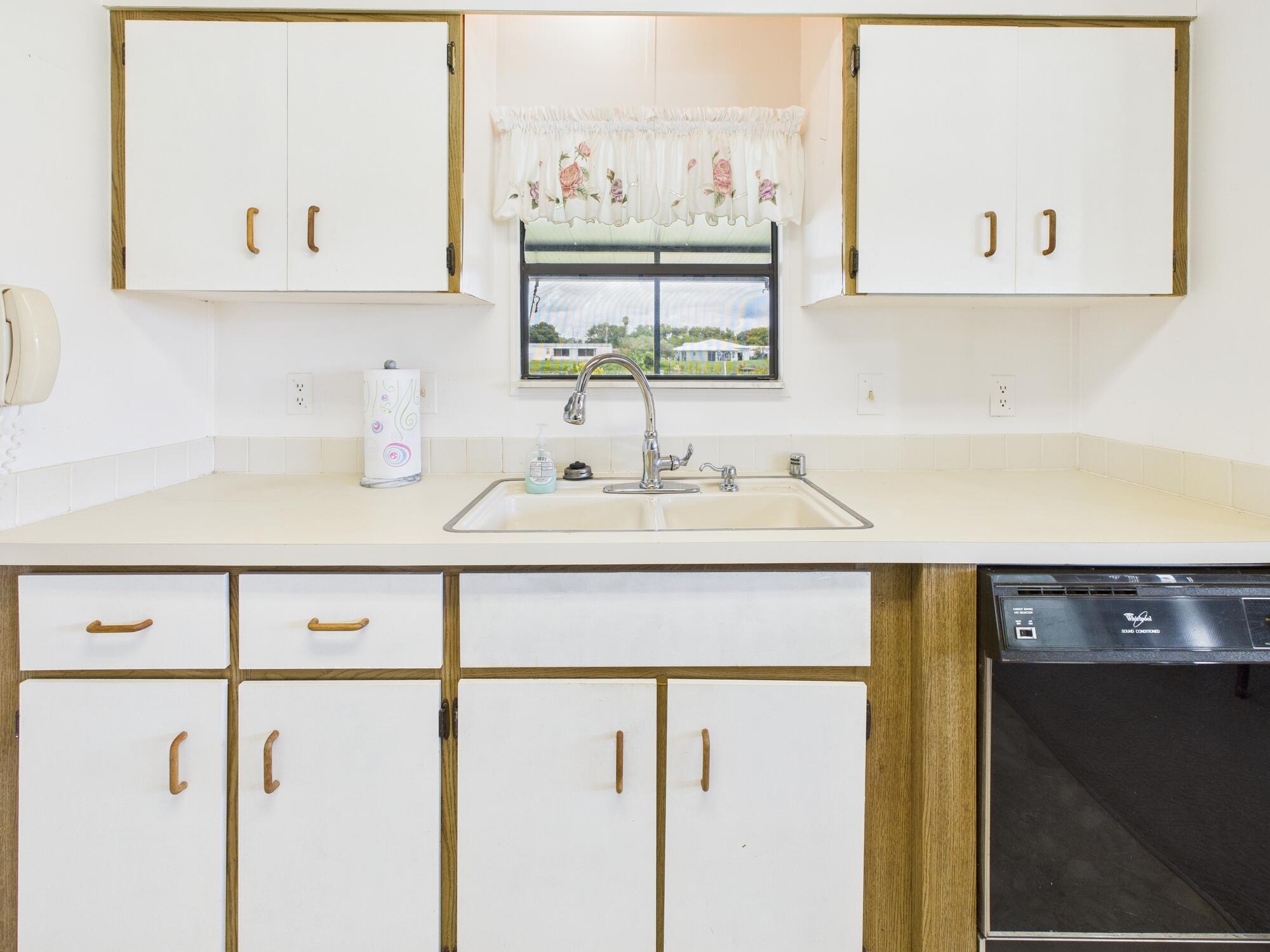 2001 Southeast 27th Street Okeechobee, FL 34974 - Photo 17 of 57 a bathroom with a sink and a mirror