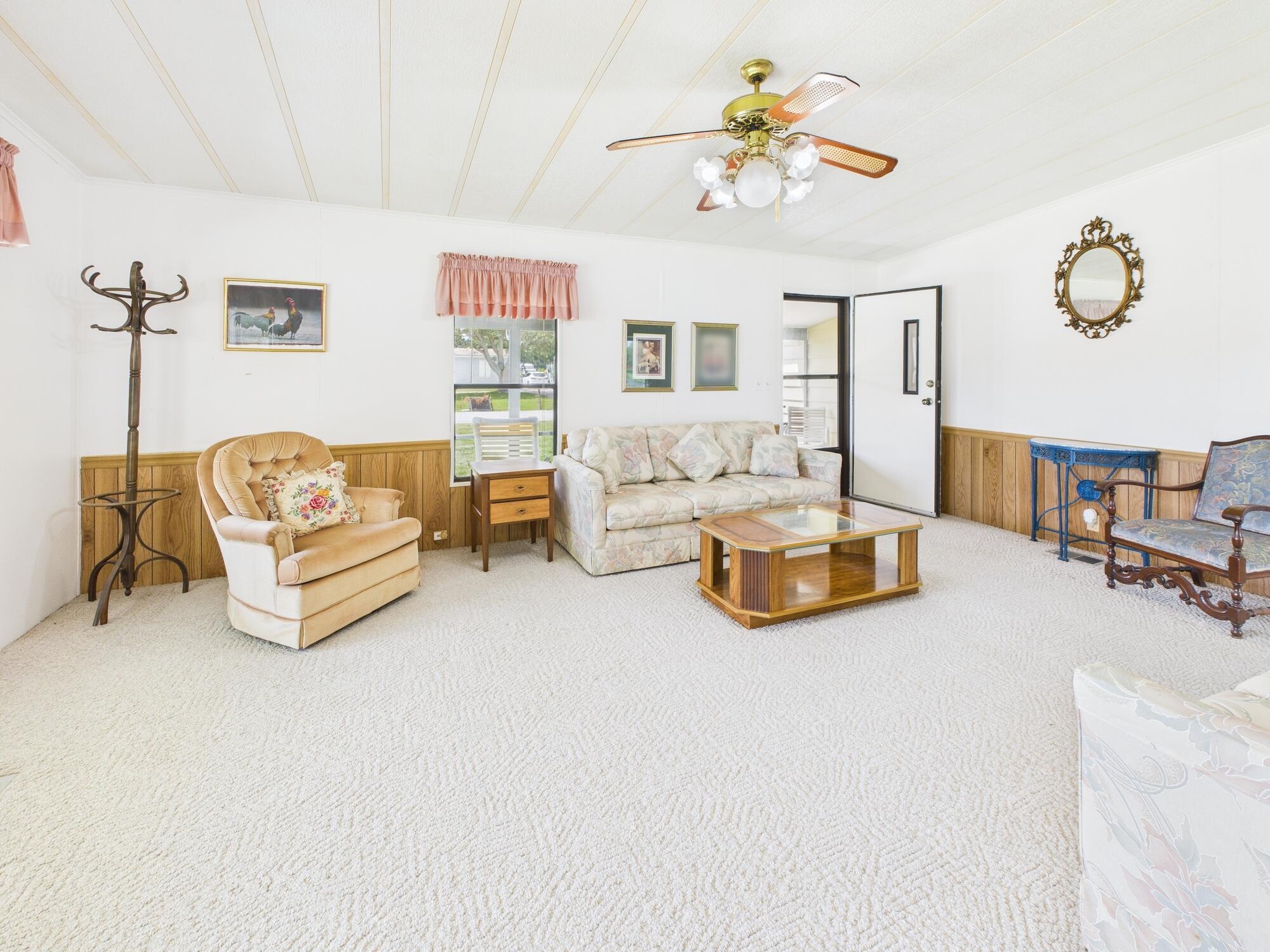 2001 Southeast 27th Street Okeechobee, FL 34974 - Photo 22 of 57 a bedroom with furniture and a chandelier