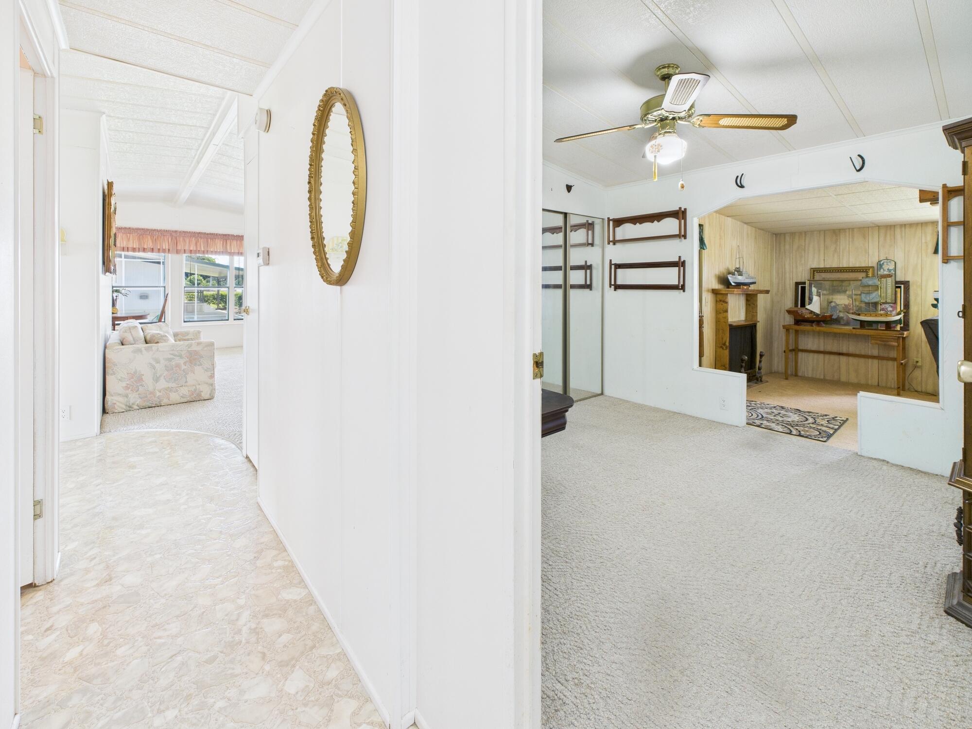 2001 Southeast 27th Street Okeechobee, FL 34974 - Photo 25 of 57 a view of a living room and bathroom with a large mirror