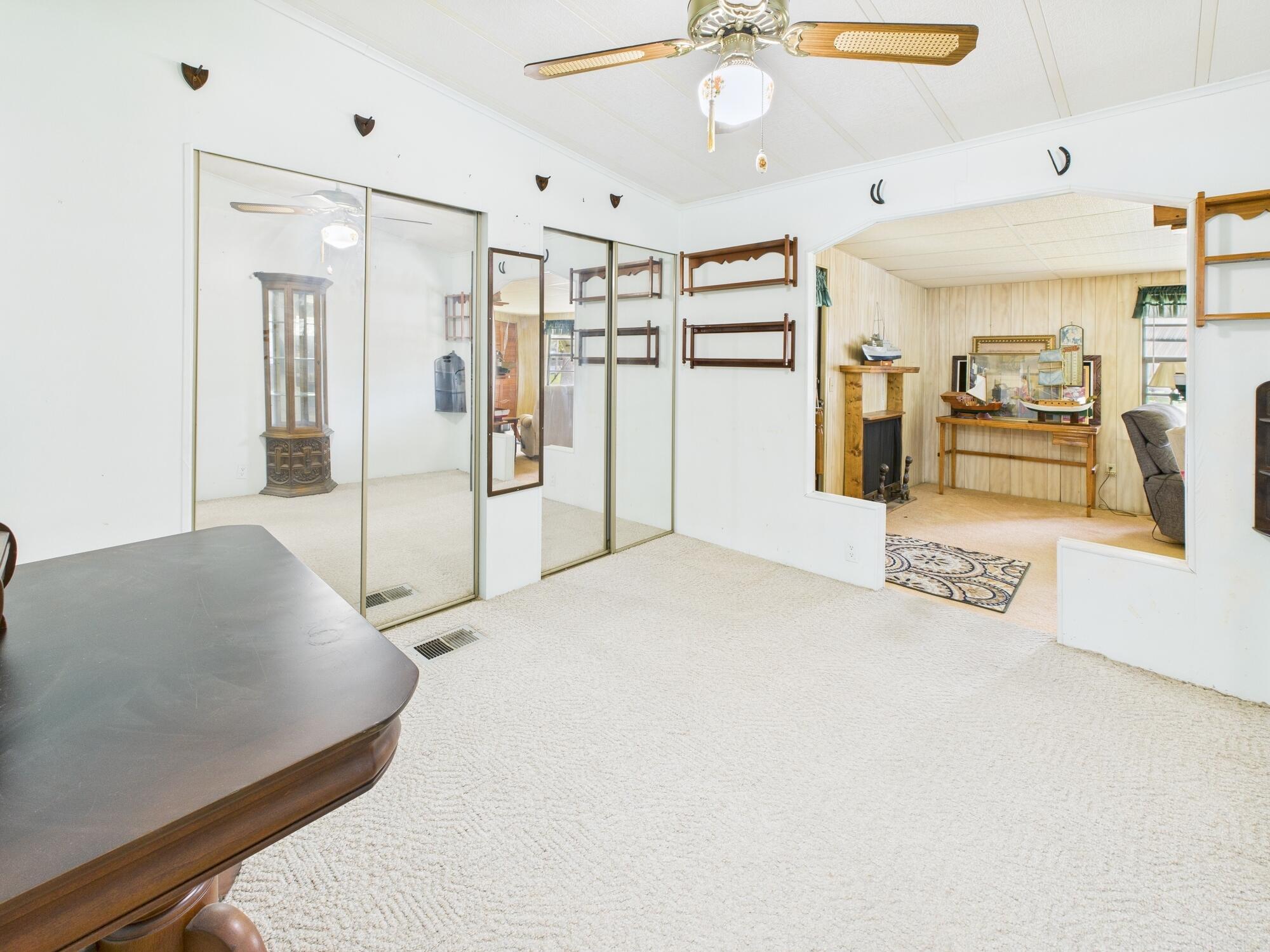 2001 Southeast 27th Street Okeechobee, FL 34974 - Photo 26 of 57 a spacious bedroom with a bed and cabinets