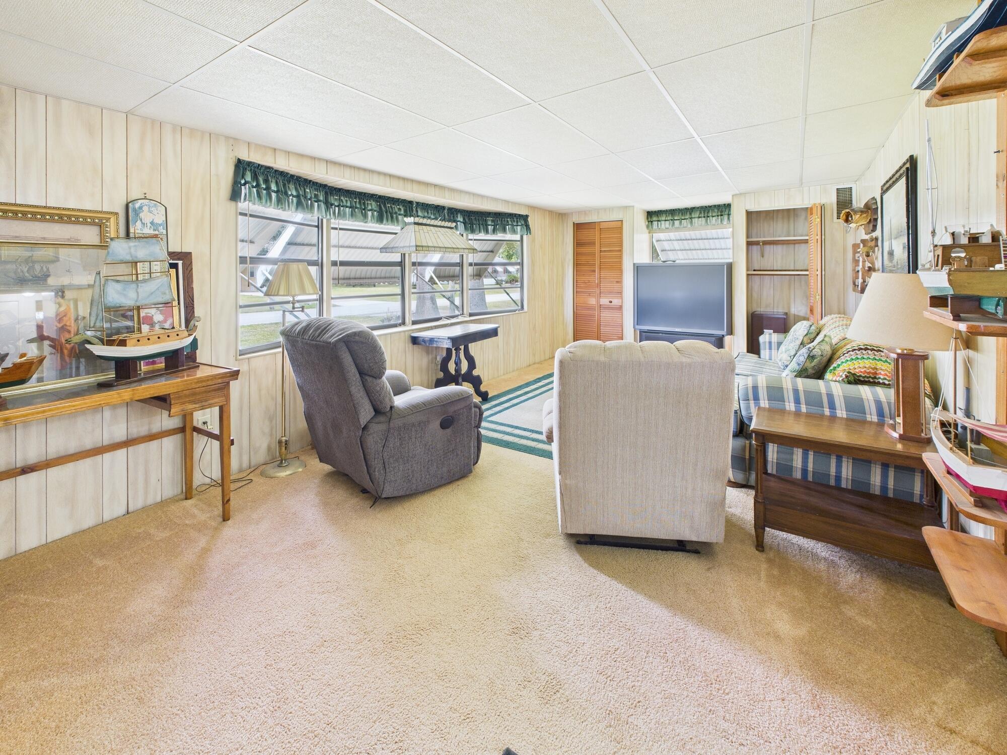 2001 Southeast 27th Street Okeechobee, FL 34974 - Photo 29 of 57 a living room with furniture and a large window