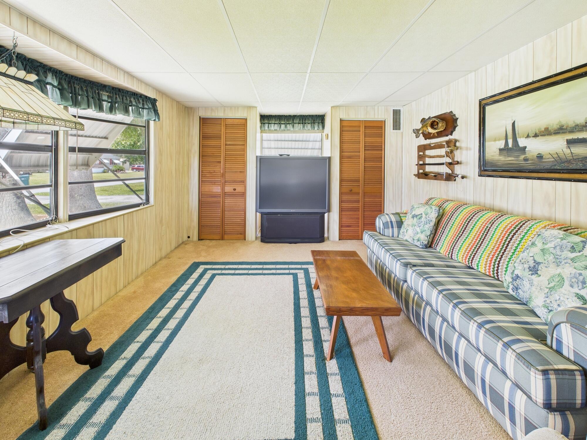 2001 Southeast 27th Street Okeechobee, FL 34974 - Photo 30 of 57 a bedroom with a bed and a large window