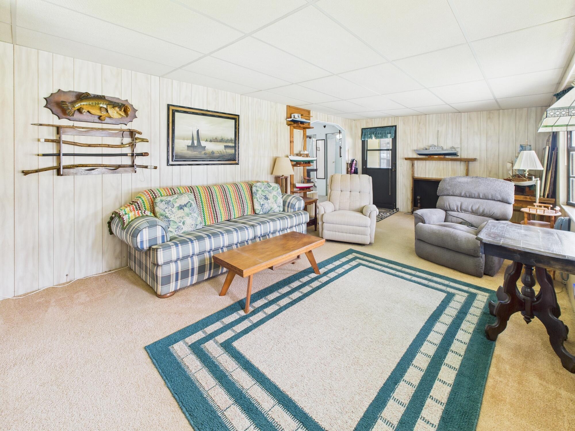 2001 Southeast 27th Street Okeechobee, FL 34974 - Photo 32 of 57 a living room with furniture rug and window