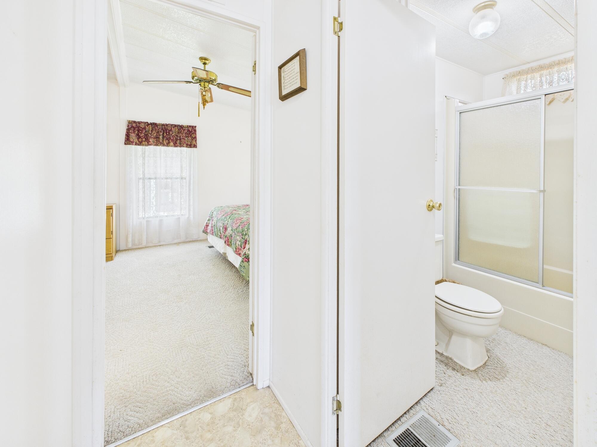 2001 Southeast 27th Street Okeechobee, FL 34974 - Photo 34 of 57 a bathroom with a toilet and a shower