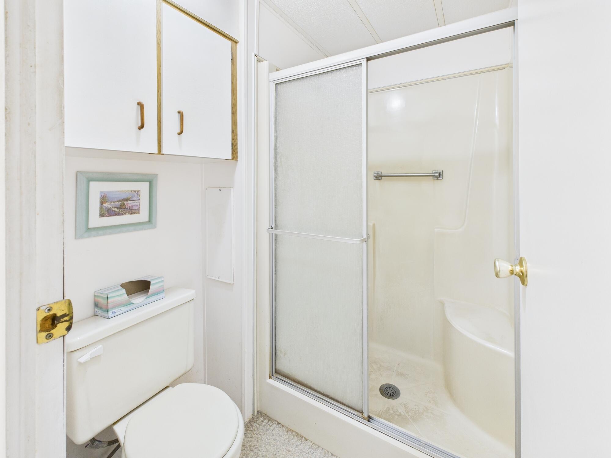 2001 Southeast 27th Street Okeechobee, FL 34974 - Photo 35 of 57 a white toilet sitting next to a bathroom sink