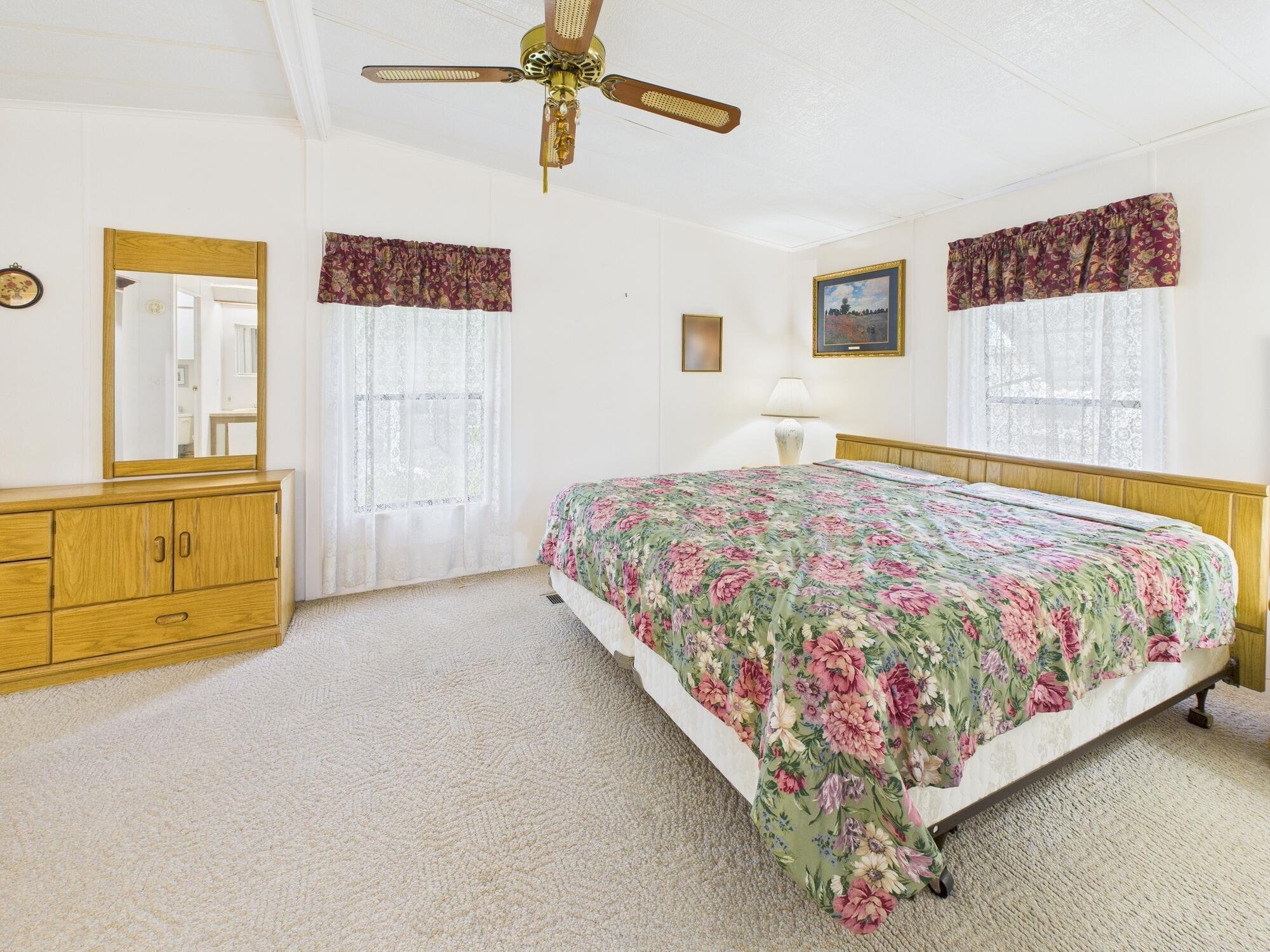 2001 Southeast 27th Street Okeechobee, FL 34974 - Photo 36 of 57 a bed sitting in a bedroom next to a window