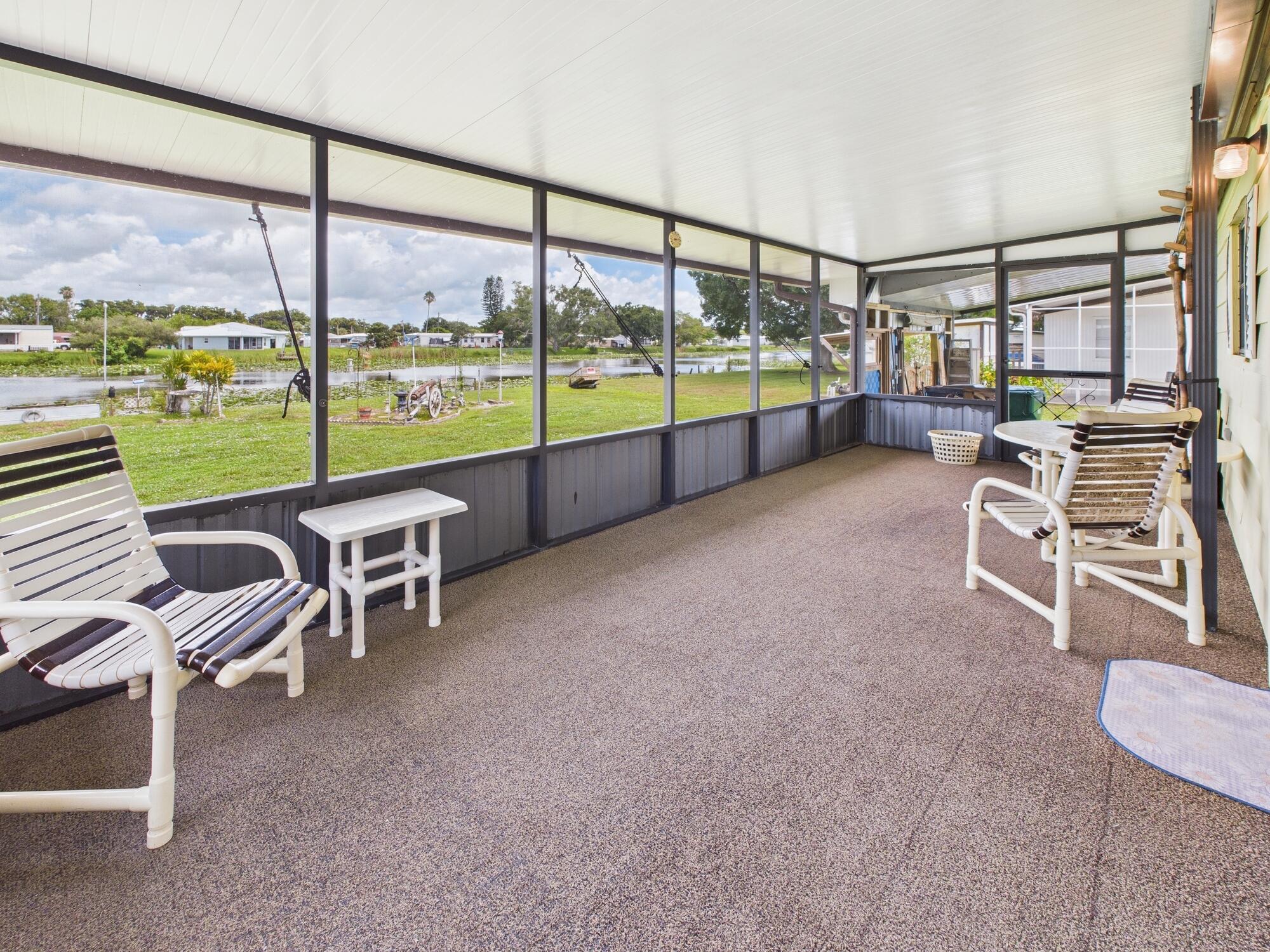 2001 Southeast 27th Street Okeechobee, FL 34974 - Photo 46 of 57 a room with furniture and a floor to ceiling window