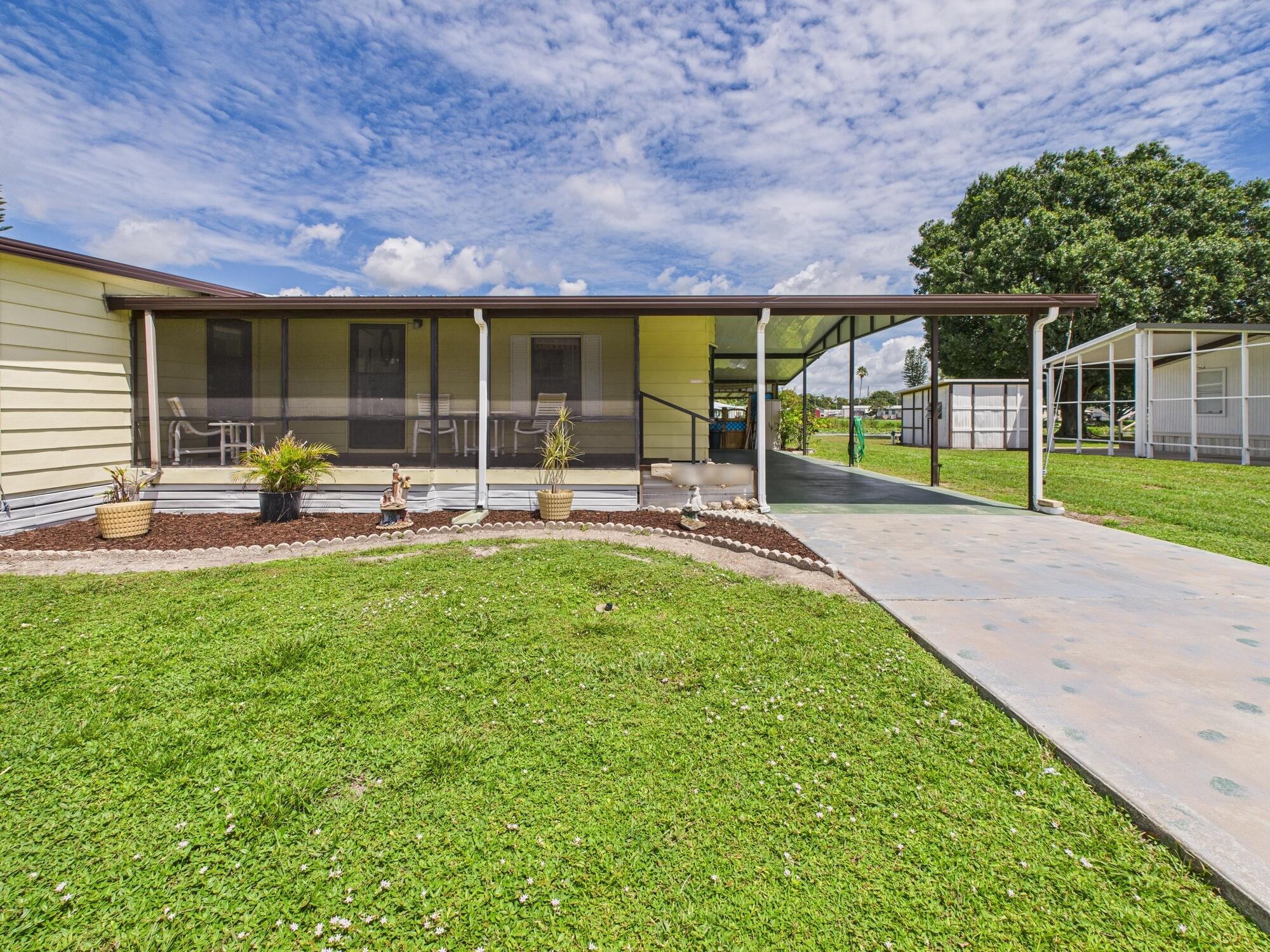 2001 Southeast 27th Street Okeechobee, FL 34974 - Photo 5 of 57 a garden view with a seating space and garden