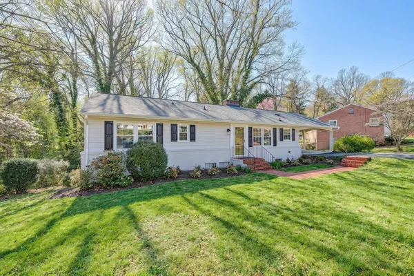 a view of a living room and floor to ceiling window an empty room