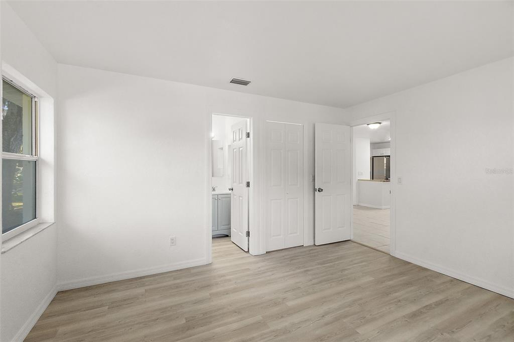 145 Oak Ridge Avenue Edgewater, FL 32132 - Photo 14 of 32 a view of a room with wooden floor and windows