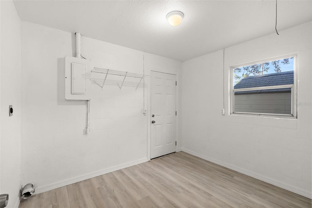 145 Oak Ridge Avenue Edgewater, FL 32132 - Photo 22 of 32 a view of room with hallway and wooden floor