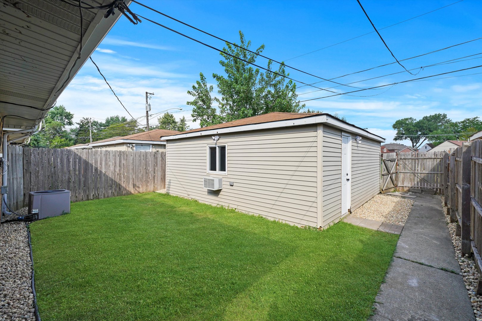 5206 State Road Burbank, IL 60459 - Photo 4 of 5 a view of a backyard with plants and a backyard