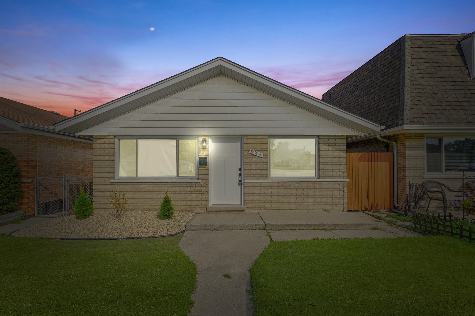 5206 State Road Burbank, IL 60459 - Photo 5 of 5 a front view of a house with garden