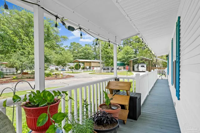 a view of a chairs and table in the balcony