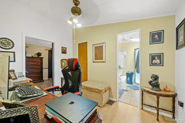 a living room with furniture a rug and a window