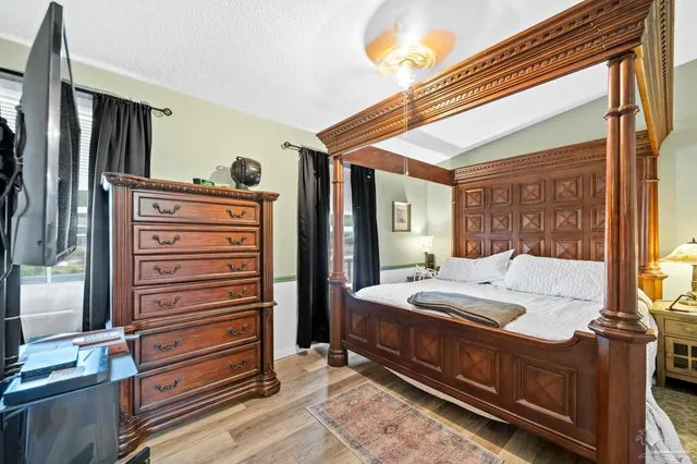 a bedroom with a bed and a dresser