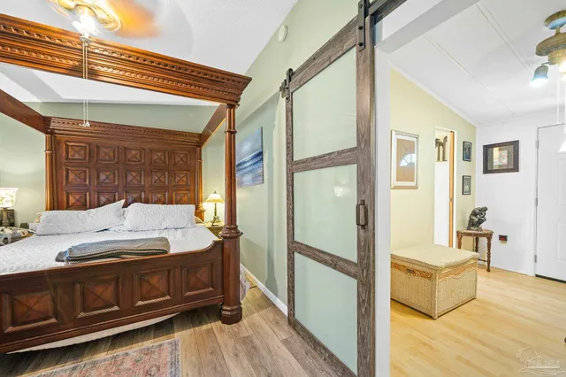 a en suite bathroom with a granite countertop sink and a mirror