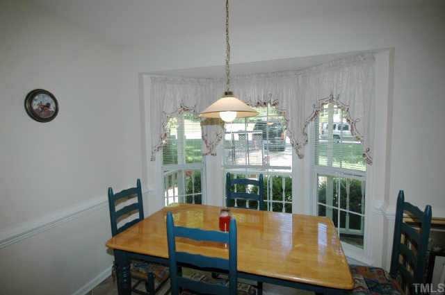 2105 Bufflehead Road Raleigh, NC 27616 - Photo 7 of 12 a view of a dining room with furniture window and outside view