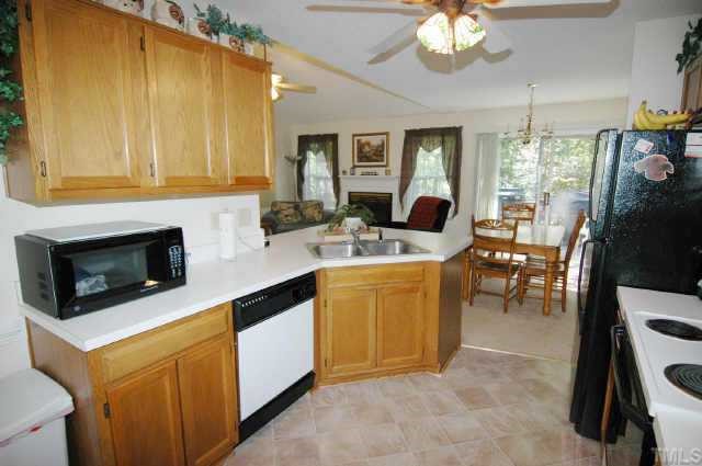 2105 Bufflehead Road Raleigh, NC 27616 - Photo 8 of 12 a kitchen with a sink stove and cabinets