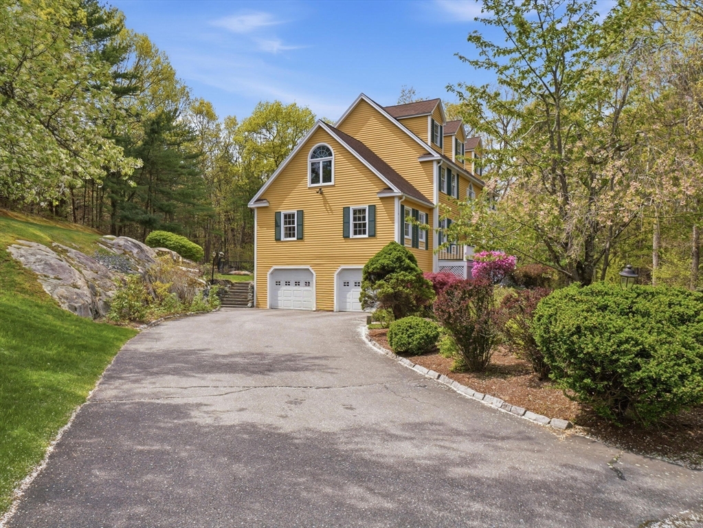 10 Hawk Ridge Road Andover, MA 01810 - Photo 3 of 32 a view of a house with a yard and potted plants