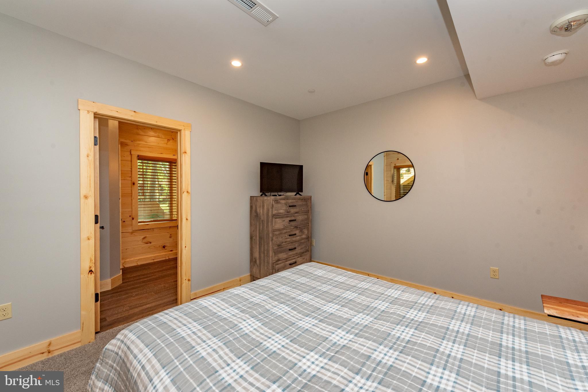 110 Wisp Adventure Road McHenry, MD 21541 - Photo 41 of 73 a bedroom with a bed and a window