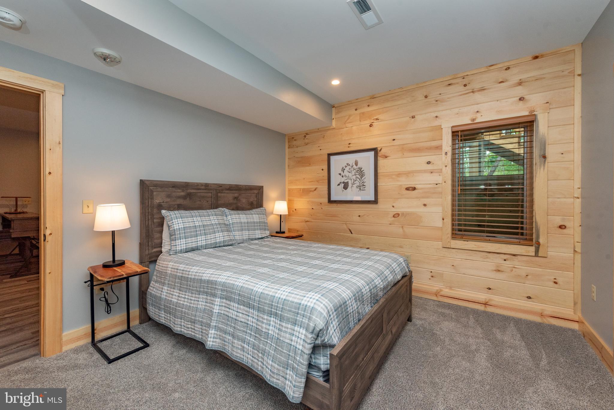 110 Wisp Adventure Road McHenry, MD 21541 - Photo 43 of 73 a bedroom with a bed and two windows