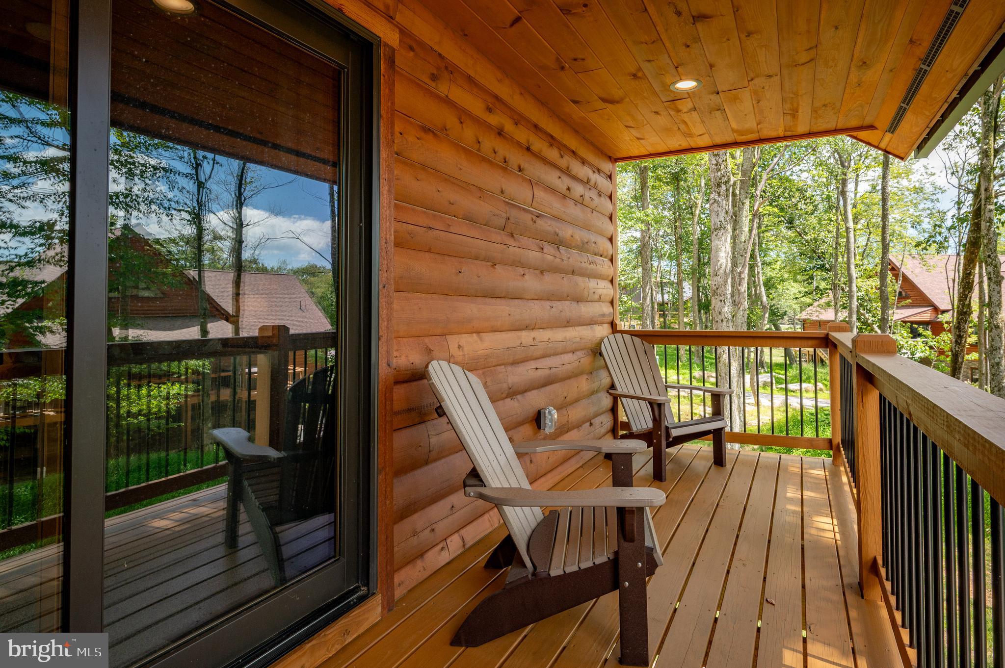 110 Wisp Adventure Road McHenry, MD 21541 - Photo 66 of 73 a view of a balcony with chairs and wooden floor