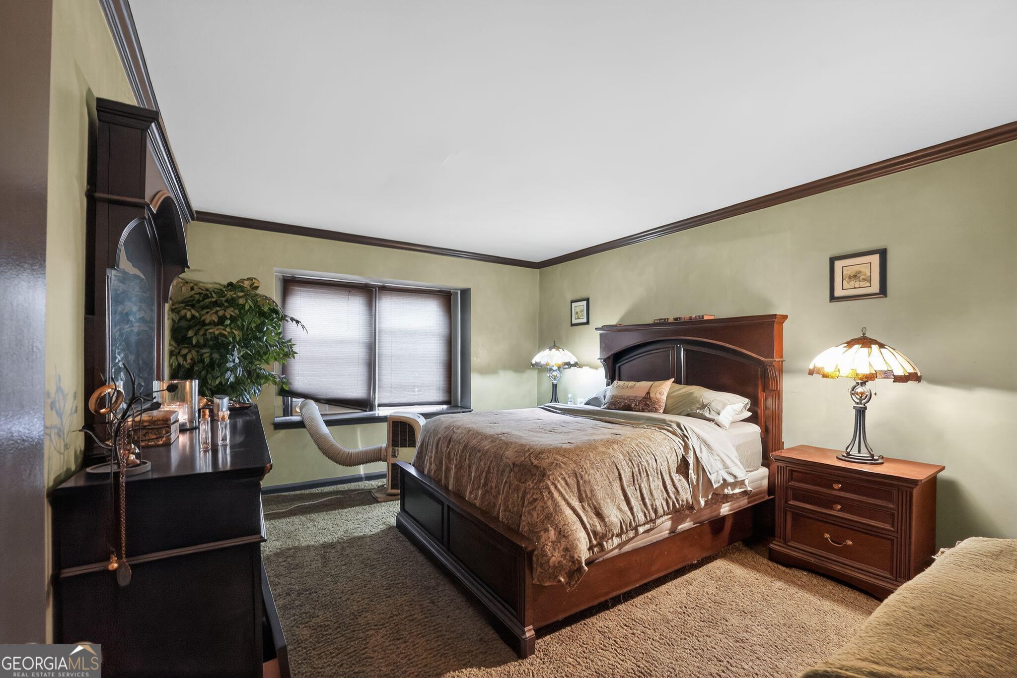 68 Montre Square Northwest Atlanta, GA 30327 - Photo 11 of 16 a bedroom with a bed and window