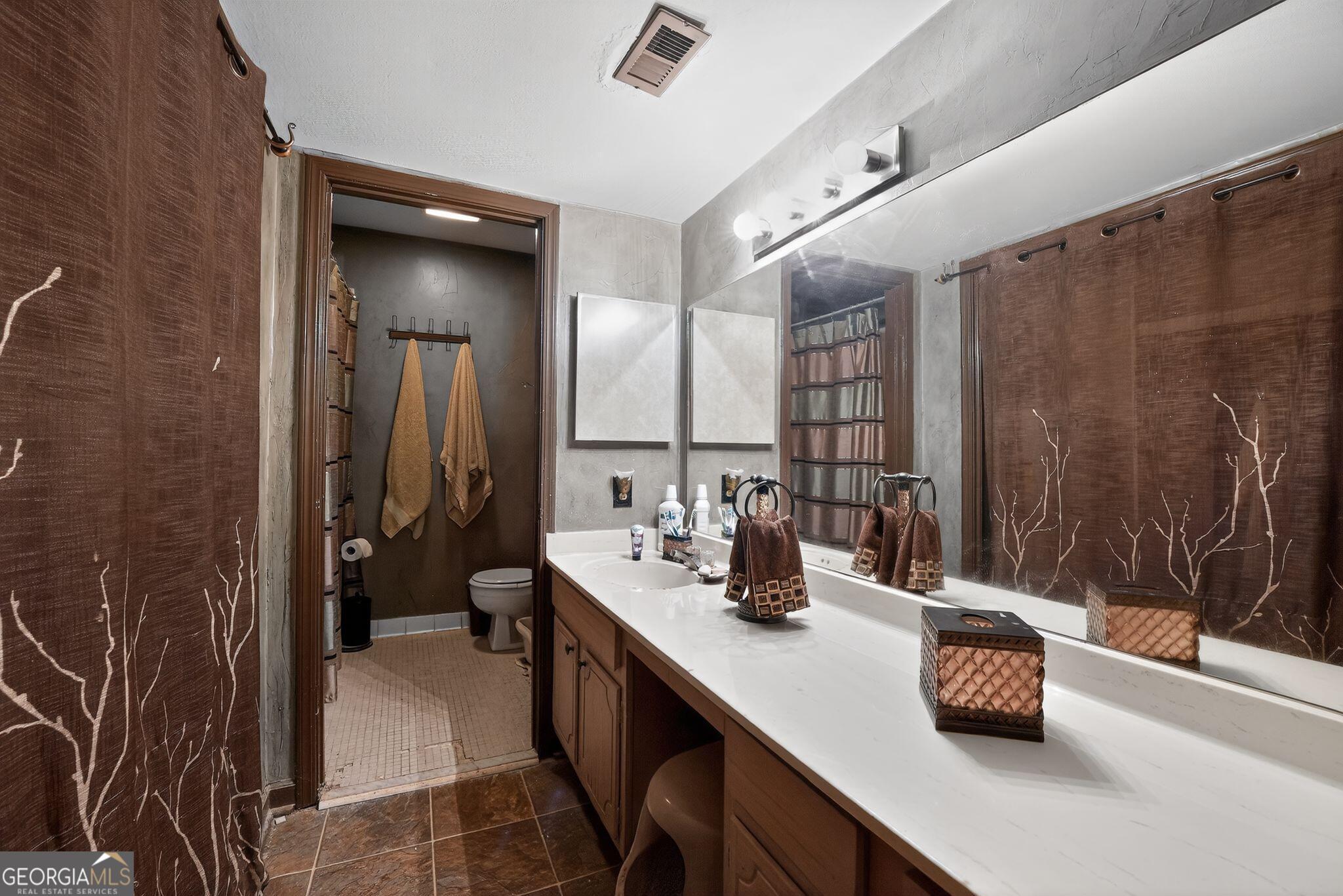 68 Montre Square Northwest Atlanta, GA 30327 - Photo 14 of 16 a kitchen with a sink and a mirror