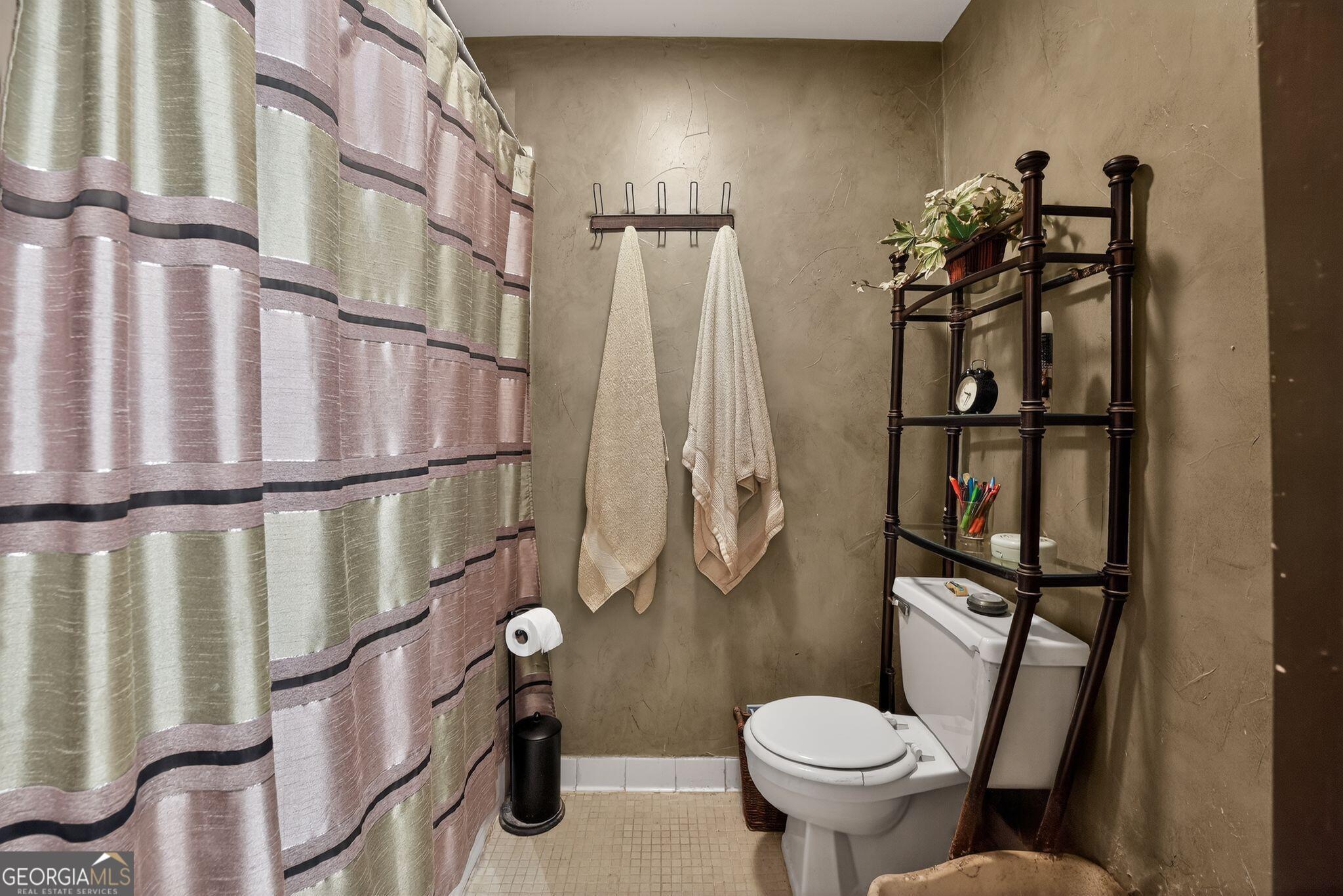 68 Montre Square Northwest Atlanta, GA 30327 - Photo 15 of 16 a bathroom with a toilet sink and tub