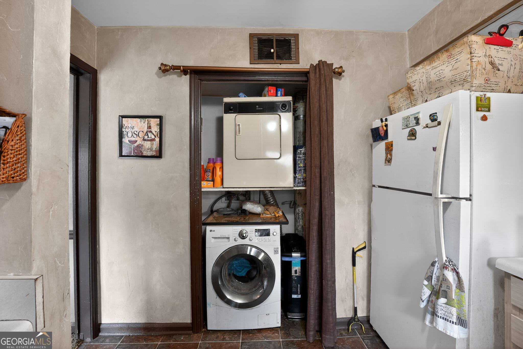 68 Montre Square Northwest Atlanta, GA 30327 - Photo 16 of 16 a view of a kitchen with washer and dryer