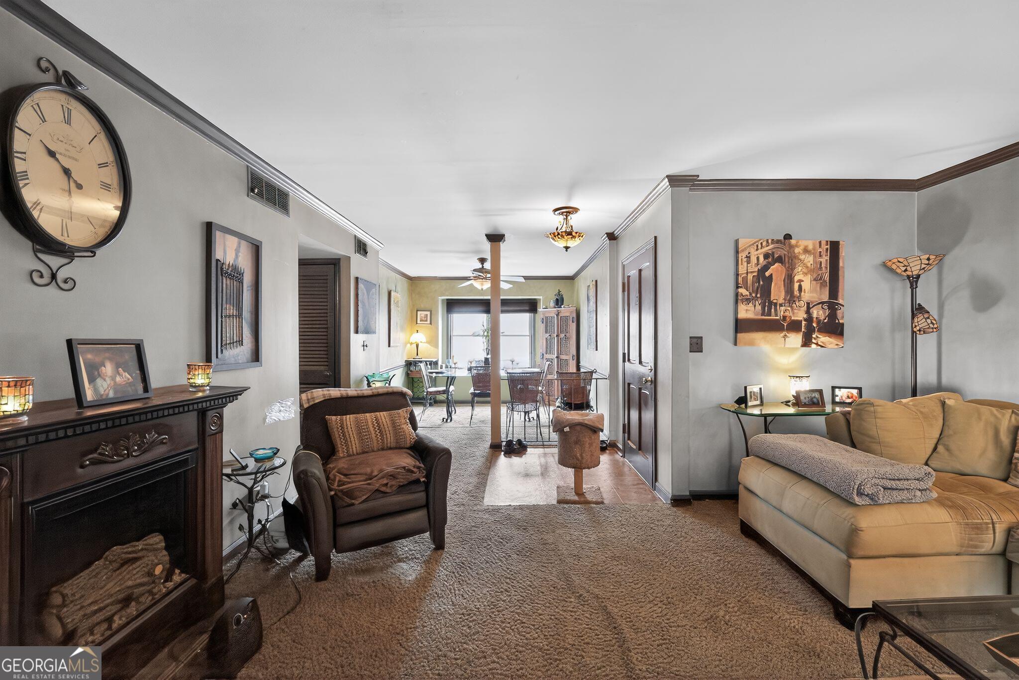 68 Montre Square Northwest Atlanta, GA 30327 - Photo 2 of 16 a living room with furniture and a fireplace