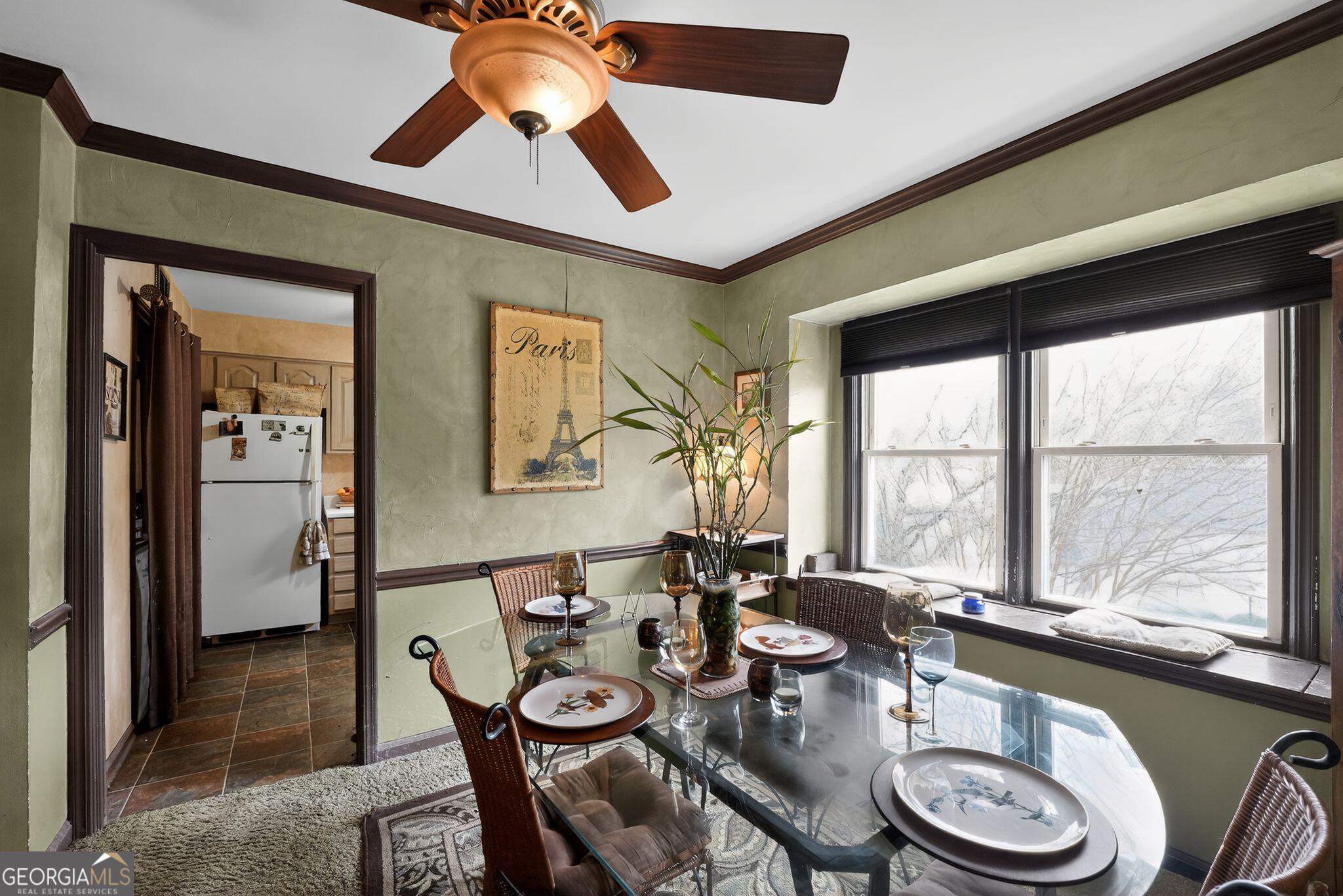 68 Montre Square Northwest Atlanta, GA 30327 - Photo 9 of 16 a very nice looking dining room with a large window and dining table