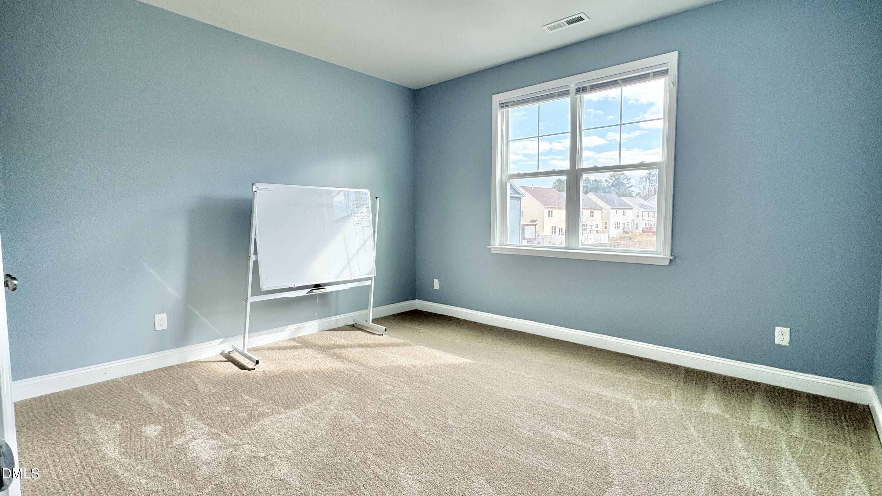 5401 Razan Street Raleigh, NC 27616 - Photo 22 of 30 an empty room with windows