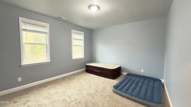 a room with window and a wooden floor