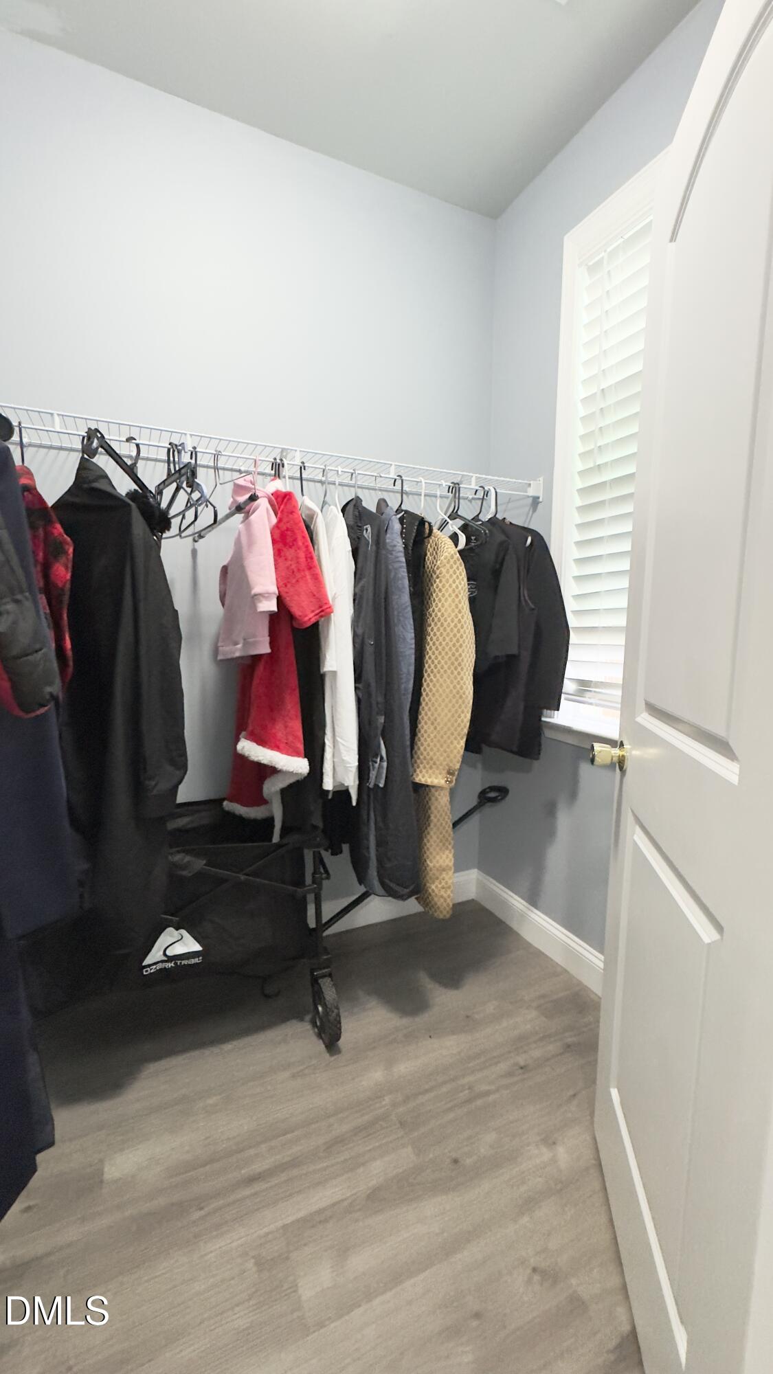 5401 Razan Street Raleigh, NC 27616 - Photo 27 of 30 a view of walk in closet with clothes and shoes
