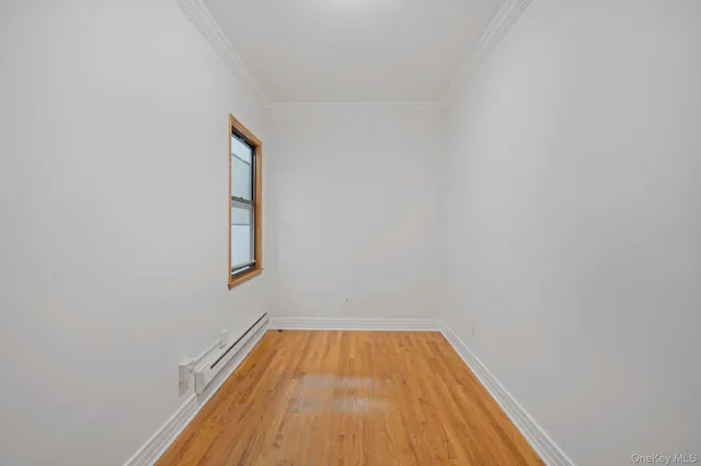 a view of a room with wooden floor and small space