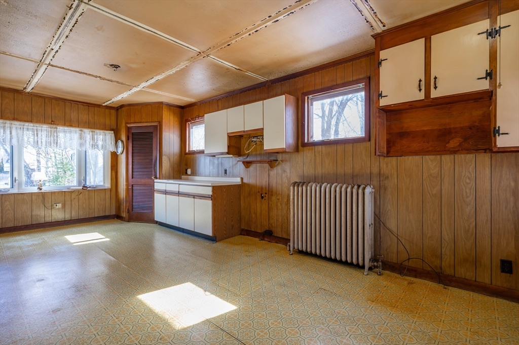 34 Summer Street Saugus, MA 01906 - Photo 14 of 35 a view of a kitchen with a sink and dishwasher next to a window
