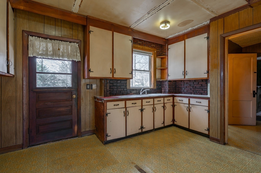 34 Summer Street Saugus, MA 01906 - Photo 17 of 35 a kitchen with stainless steel appliances granite countertop a stove a sink and a refrigerator