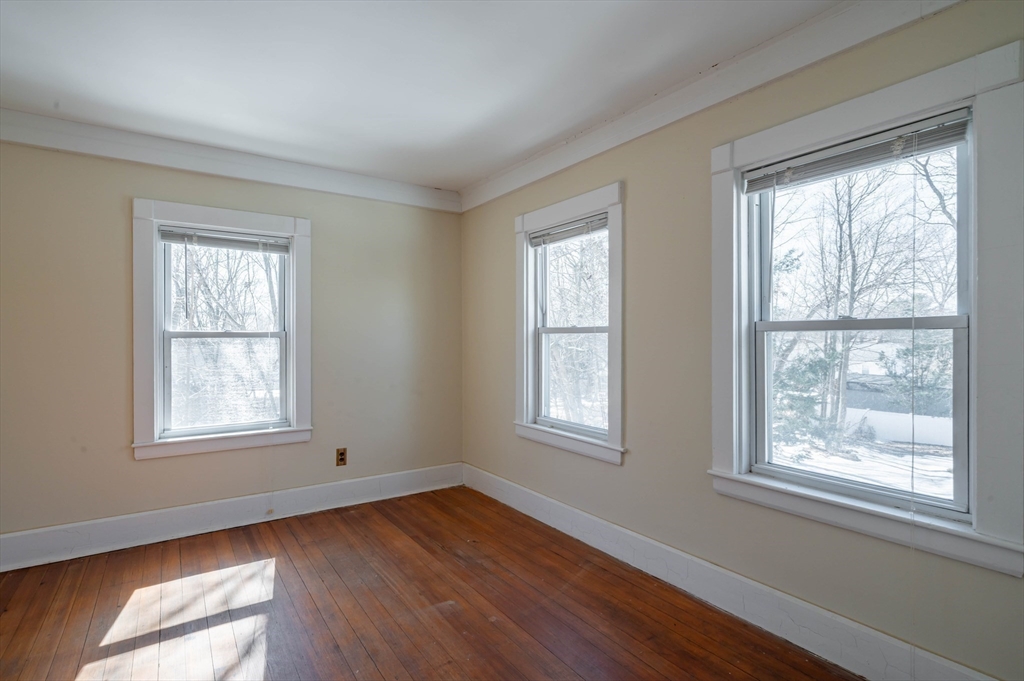 34 Summer Street Saugus, MA 01906 - Photo 20 of 35 a view of an empty room with wooden floor and a window