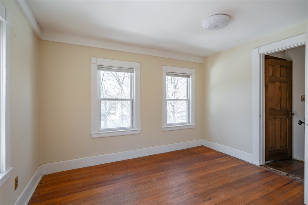 34 Summer Street Saugus, MA 01906 - Photo 21 of 35 an empty room with wooden floor and windows