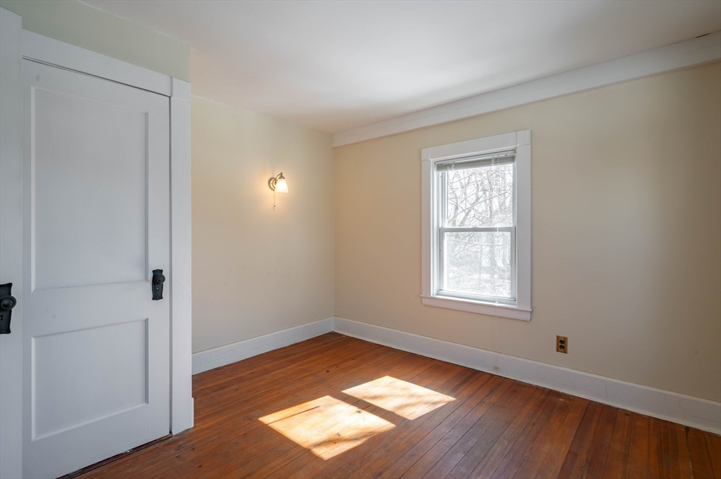 34 Summer Street Saugus, MA 01906 - Photo 22 of 35 an empty room with wooden floor and windows