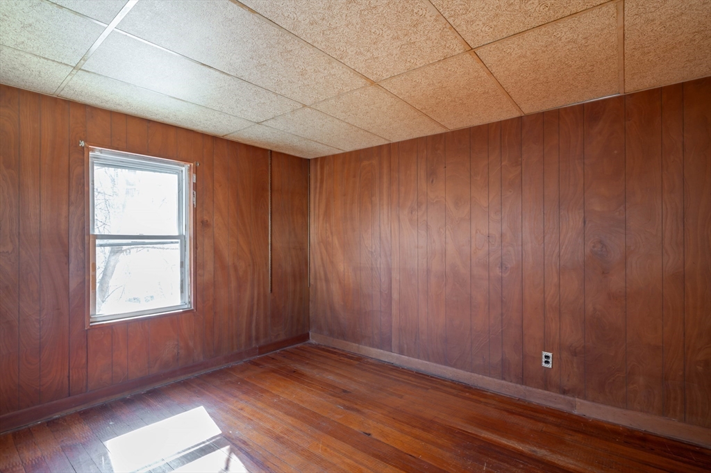 34 Summer Street Saugus, MA 01906 - Photo 27 of 35 an empty room with wooden floor and windows